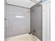 This bathroom features a shower with gray subway tile and updated fixtures at 1379 Keys Lake Ne Dr, Brookhaven, GA 30319