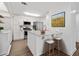 Bright kitchen features white cabinets, stainless steel appliances, and a marble countertop island with seating at 1379 Keys Lake Ne Dr, Brookhaven, GA 30319