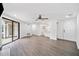Open floor plan with modern flooring and an abundance of natural light from sliding glass door at 1379 Keys Lake Ne Dr, Brookhaven, GA 30319