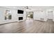 Spacious living room with modern flooring, a fireplace, and abundant natural light at 1379 Keys Lake Ne Dr, Brookhaven, GA 30319