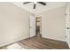 Bedroom with wood-look floors, ceiling fan, and an open doorway at 2128 Jones Nw Rd, Atlanta, GA 30318
