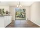 Dining room with modern chandelier and glass sliding doors to the backyard at 2128 Jones Nw Rd, Atlanta, GA 30318