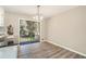 Dining room with modern chandelier and glass sliding doors to the backyard at 2128 Jones Nw Rd, Atlanta, GA 30318