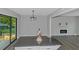 Dining area with modern lighting, sliding glass doors to the backyard, and island at 2128 Jones Nw Rd, Atlanta, GA 30318