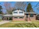 Charming two-story home with brick and siding exterior, plus a convenient covered carport at 2128 Jones Nw Rd, Atlanta, GA 30318