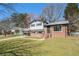 Charming two-story home with brick and siding exterior on a sunny day at 2128 Jones Nw Rd, Atlanta, GA 30318