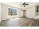 Bright living room features a ceiling fan and sleek, wood-look flooring at 2128 Jones Nw Rd, Atlanta, GA 30318
