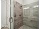 Modern tiled shower featuring glass door and sleek hardware at 226 Idylwilde Way, Canton, GA 30115