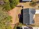Aerial view of the home featuring a backyard deck, landscaping, and neighborhood surroundings at 3876 Elm Trace Ct, Loganville, GA 30052