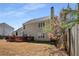 Spacious backyard featuring a wooden deck, ideal for outdoor entertaining and relaxation at 3876 Elm Trace Ct, Loganville, GA 30052