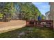 A well-maintained backyard with a wooden deck perfect for enjoying the outdoors at 3876 Elm Trace Ct, Loganville, GA 30052