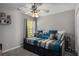 Bedroom features a day bed and natural light at 3876 Elm Trace Ct, Loganville, GA 30052