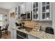 Modern kitchen with granite countertops, stainless steel appliances, and stylish backsplash at 3876 Elm Trace Ct, Loganville, GA 30052