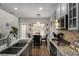 Well-appointed kitchen with a farmhouse sink, stainless steel appliances, and granite countertops, ideal for cooking and entertaining at 3876 Elm Trace Ct, Loganville, GA 30052