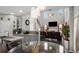 Open concept living room with high ceilings, fireplace, and eat in kitchen at 3876 Elm Trace Ct, Loganville, GA 30052