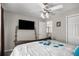 Bright bedroom features a TV and closet at 3876 Elm Trace Ct, Loganville, GA 30052