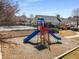 Community playground with colorful play structures and ample space for children to play at 3876 Elm Trace Ct, Loganville, GA 30052