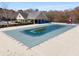 Community pool with an adjacent covered patio and playground, perfect for Gathering enjoyment at 3876 Elm Trace Ct, Loganville, GA 30052