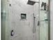 Close up of modern tiled shower with sleek fixtures at 3876 Elm Trace Ct, Loganville, GA 30052