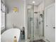 Contemporary glass shower with marble tile and built in shelves at 3876 Elm Trace Ct, Loganville, GA 30052