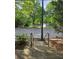 Stone steps lead to street view with lovely pond, trees and fountain at 390 17Th Nw St # 2025, Atlanta, GA 30363