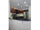 Modern kitchen with stainless steel appliances, granite countertops, and stylish pendant lighting at 390 17Th Nw St # 2025, Atlanta, GA 30363