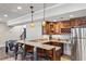 Basement bar featuring a granite countertop, wine rack, stainless steel refrigerator, and seating for entertainment at 2298 Greenglade Ne Rd, Atlanta, GA 30345