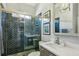Modern bathroom features a glass-enclosed shower, a quartz countertop vanity, and stylish fixtures at 2298 Greenglade Ne Rd, Atlanta, GA 30345