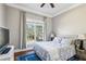 Cozy bedroom boasts hardwood floors, a large window, and soothing decor at 2298 Greenglade Ne Rd, Atlanta, GA 30345