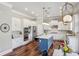 Beautiful kitchen features an island with a breakfast bar, stainless appliances, and modern lighting at 2298 Greenglade Ne Rd, Atlanta, GA 30345