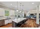 Open kitchen and living room with hardwood floors, stainless appliances, and center island with bar stool seating at 2298 Greenglade Ne Rd, Atlanta, GA 30345
