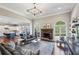 Open-concept living room with a stone fireplace at 2298 Greenglade Ne Rd, Atlanta, GA 30345