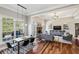 Inviting living room and dining area features hardwood floors, a fireplace, and an abundance of natural light at 2298 Greenglade Ne Rd, Atlanta, GA 30345