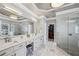 Luxury bathroom features a double vanity, a glass shower, and modern lighting at 2298 Greenglade Ne Rd, Atlanta, GA 30345