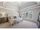 Spacious main bedroom features trey ceilings, plush carpet, and large windows at 2298 Greenglade Ne Rd, Atlanta, GA 30345
