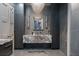 Bathroom with a marble vanity, decorative lighting fixtures, and storage cabinets at 4100 Oak Hill Rd, Douglasville, GA 30135
