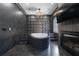 Bathroom featuring a modern tub, fireplace, and geometrical wall design, with luxury lighting at 4100 Oak Hill Rd, Douglasville, GA 30135