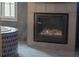 Luxurious bathroom showcasing a modern fireplace and unique textured wall tiles next to a soaking tub at 4100 Oak Hill Rd, Douglasville, GA 30135