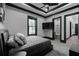 Well-lit bedroom offers soft carpet, a ceiling fan, and a comfortable bed at 4100 Oak Hill Rd, Douglasville, GA 30135