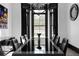 Elegant dining room with large window and sophisticated black decor at 4100 Oak Hill Rd, Douglasville, GA 30135