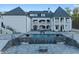 Gorgeous home exterior featuring pool, manicured yard and elegant white facade at 4100 Oak Hill Rd, Douglasville, GA 30135