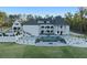 Grand estate showcasing elegant architecture, lush landscaping, and a pristine pool area at 4100 Oak Hill Rd, Douglasville, GA 30135