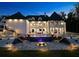 Stunning home exterior with manicured yard and beautiful in-ground pool at twilight at 4100 Oak Hill Rd, Douglasville, GA 30135
