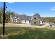 Stunning stone and stucco home with a sprawling lawn and circular driveway at 4100 Oak Hill Rd, Douglasville, GA 30135