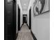 Hallway with beautiful hardwood-style floors and modern black trim and door casings at 4100 Oak Hill Rd, Douglasville, GA 30135