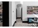 Bright hallway featuring a painting, black trim, and access to other rooms at 4100 Oak Hill Rd, Douglasville, GA 30135