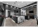 Open concept kitchen with a marble island, modern appliances, and a cozy living area at 4100 Oak Hill Rd, Douglasville, GA 30135