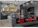 Modern kitchen with black cabinets, granite countertops, marble backsplash, and seating at the island at 4100 Oak Hill Rd, Douglasville, GA 30135