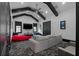 Spacious living room featuring stylish seating, large screen TV, and black accent beams at 4100 Oak Hill Rd, Douglasville, GA 30135