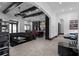 View of the open-concept living space and modern kitchen, showcasing the high ceilings and beam details at 4100 Oak Hill Rd, Douglasville, GA 30135
